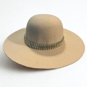 Wide-brimmed beige hat with a decorative metallic band around the base of the crown, displayed on a white background.