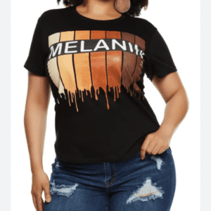 Someone wearing the Melanin T-shirt SIZE L, featuring "MELANIN" and a dripping paint design in skin tones, paired with ripped denim shorts.