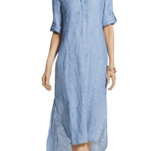 Woman wearing a light blue, long-sleeve, button-front midi dress with rolled-up sleeves and a curved hem, accessorized with bracelets and sandals.