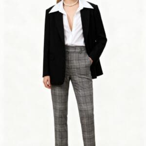 Woman stands against a plain background wearing Plaid Straight Leg Dress Pants SIZE L, a black blazer, white shirt with open collar, black flats, and a pearl necklace.