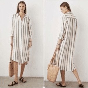 Woman wearing the Striped Long Sleeve Long Shirt Dress, a knee-length white shirt dress with vertical black stripes, styled with black sandals and a woven tote bag, shown from both front and back views.
