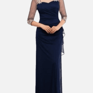 Woman wearing a navy blue floor-length gown with sheer three-quarter sleeves and embroidered detailing on the shoulders and sleeve cuffs.