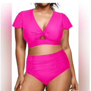Woman wearing a bright pink bikini with a knotted top and high-waisted ruched bottoms, standing against a plain background.