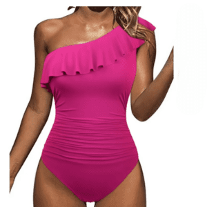 Woman wearing a bright pink one-shoulder swimsuit with a ruffle detail across the top and ruched sides, shown against a plain white background.
