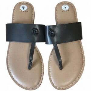 A pair of tan and black thong sandals with a wide black strap and a tan footbed, labeled as size 7.
