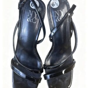 A pair of black strappy heeled sandals by NY & Co, size 6.5, with square toes and shiny patent finish, viewed from above.