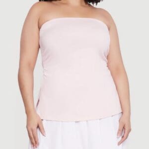 A person wearing a light pink strapless top and a white skirt, shown from the shoulders to the hips against a plain background.