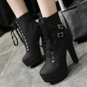 Black lace-up platform ankle boots with side buckles and block heels.