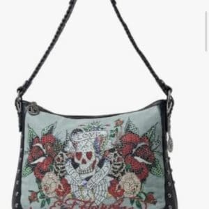 Ed Hardy shoulder bag with a skull and rose rhinestone graphic, text reading “Love Kills Slowly,” and black leather trim with stud accents.