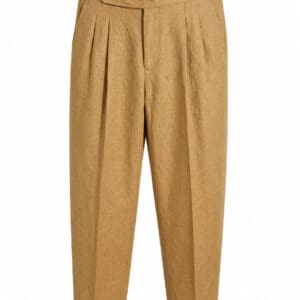 Tan pleated trousers with a button-tab waist.