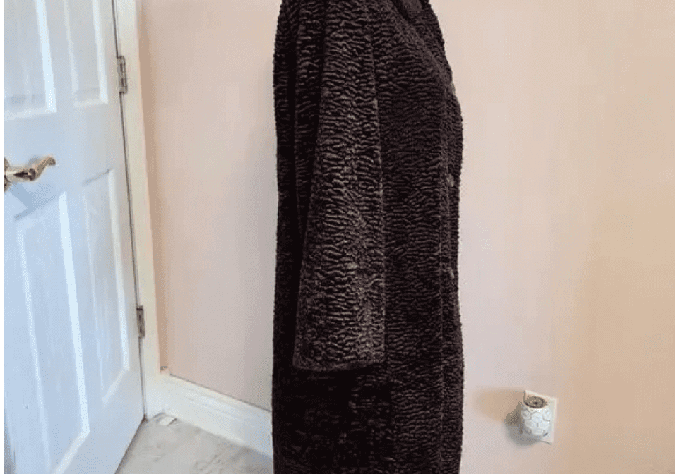 A 2 pc pink wide leg pants set is displayed on a mannequin in a room with light pink walls and a framed quote on the wall.