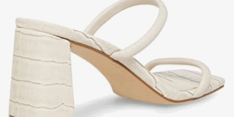 A heeled sandal with a square toe, two thin straps, and a textured block heel in an off-white color.